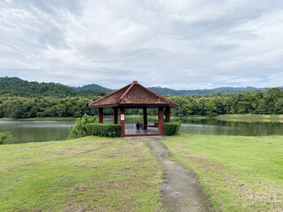Fototapeta na wymiar beautiful tropical landscape with lake and pavilion