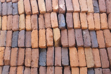 pile of red bricks to build a house	