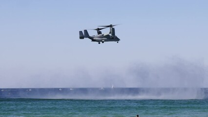 Slow motion footage of a Bell Boeing V-22 Osprey flying over the sea at Gold Coast Pacific Airshow, QLD, Australia on August 19, 2023.