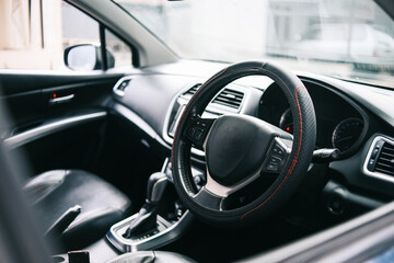 Car interior. Steering wheel, shift lever and dashboard.