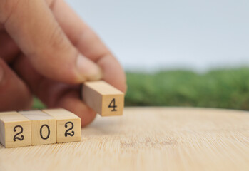 hand choosing the number 4 in new year 2024 concept