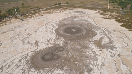 Mud volcano bledug kuwu. aerial view volcanic plateau with geothermal activity and geysers, Indonesia java. aerial view volcanic landscape