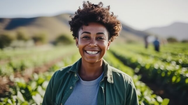 Portrait of a middle aged African American female farmer working on a farm field.