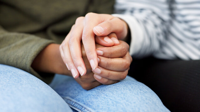 Holding hands, support and closeup of a couple in therapy for love, respect or trust in marriage. Together, hope and people with care, help and in counseling for relationship with compassion - Powered by Adobe