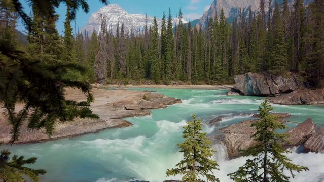 Immerse yourself in the breathtaking beauty of Banff, Canada, as captured in this cinematic video. This enchanting video transports you to the heart of the Canadian Rockies rivers and mountains.