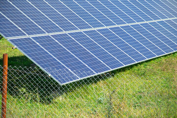 Solar panels in the green field.