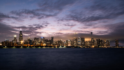 Chicago skyline with dramatic clouds at sunset.