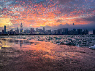Fototapeta premium Chicago skyline with dramatic clouds at sunset.