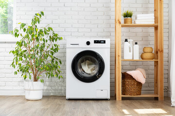 Modern white washing machine close up photo