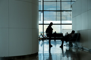 Passenger silhouettes in terminal T4 of Madrid airport. Adolfo Suarez-Barajas. Arial transport...