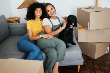 Homeowner, portrait and lesbian couple with a dog on the sofa for moving boxes and a new home....