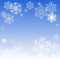 White snowflakes on a blue gradient background.  Winter theme background.  Negative space