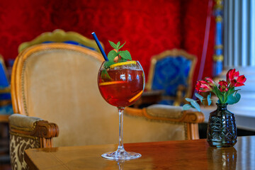 Cocktails waiting for customers and a colorful luxury interior at a luxury bar in the Carre d’Or, Nice, French Riviera, South of France