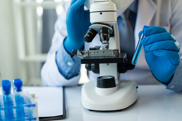 Scientist or doctor using technology is doing research on microfiber, microbiology, medicine,...