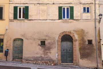 Calvi dell'Umbria Building Facade with Windows and Old Aged Wooden Doors, Italy
