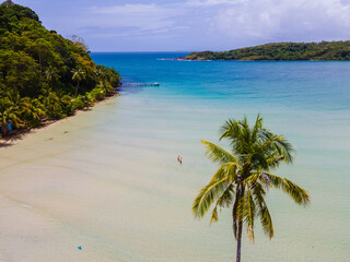 Bang Bao Beach Koh Kood Island Thailand Trat , tropical beach with palm trees and a turqouse colored ocean on a sunny day, Ko Kut Island with coconut palm trees on the beach, drone aerial view