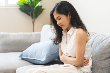 Flatulence ulcer, asian young woman, girl hands in belly, stomach pain from food poisoning, abdominal pain and digestive problem, gastritis or diarrhoea. Abdomen inflammation, menstrual period people.