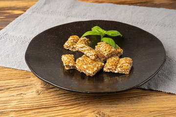 Sunflower Seeds Bar on Black Plate, Energy Snack with Honey, Sun Flower Seed Muesli Dessert