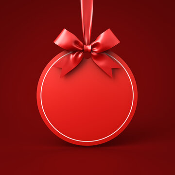 Blank red round sign hanging with red ribbon and bow isolated on dark red background minimal christmas decorations conceptual 3D rendering