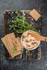 Fresh homemade chicken liver pate on a wooden board. vertical image. top view. place for text - obrazy, fototapety, plakaty