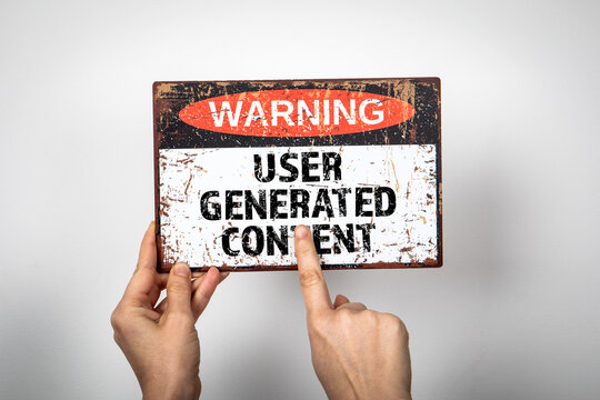 USER GENERATED CONTENT. Warning sign on a white background