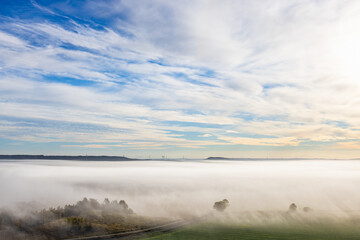 Fototapeta na wymiar Morning fog over an agricultural landscape