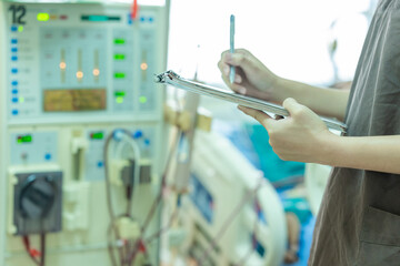 The specialist are checking continuous renal replacement therapy equipment and injection pump and...