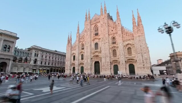 Hyperlapse view of people at the historic Piazza del Duomo at sunset in Milan, Italy. 