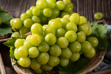fresh green shine muscat grape on wooden table
