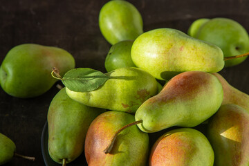 Parisian pear variety. Fruits on the table. Autumn harvest. Pears top view background. Green yellow red color pear. Vitamin vegan food.