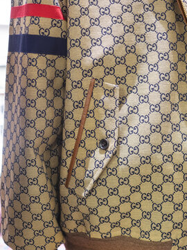Beige logo fabric jacket with leather trim by Gucci.Milan - Italy,17 September 2023