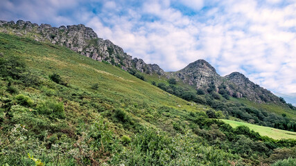 Fototapeta na wymiar Magnificent landscape of the Basque Country and its green mountains taken during a hike on the Rhune