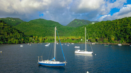 White Boats and Yachts in the Green Lagoon of Guadeloupe Island, Caribbean islands