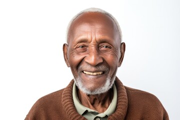 portrait of a confident Kenyan man in his 90s wearing a chic cardigan against a white background