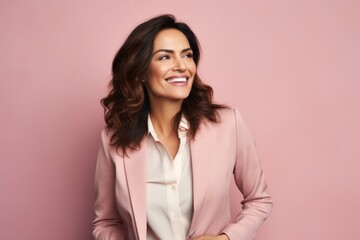 Fototapeta premium portrait of a confident Mexican woman in her 40s wearing a classic blazer against a pastel or soft colors background