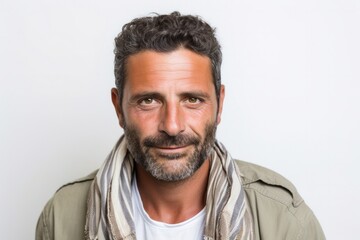 Obraz premium Portrait of a Israeli man in his 40s wearing a foulard against a white background