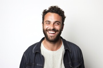 medium shot portrait of a happy Israeli man in his 30s wearing a chic cardigan against a white background