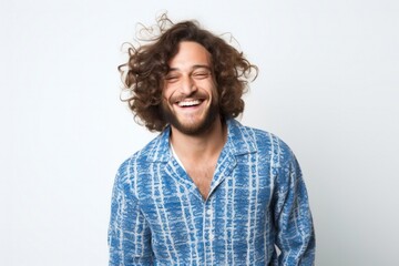 portrait of a happy Israeli man in his 30s wearing a snuggly pajama set against a white background - obrazy, fototapety, plakaty