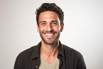 Obraz premium portrait of a happy Israeli man in his 30s wearing a chic cardigan against a white background