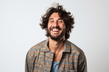 Obraz premium portrait of a happy Israeli man in his 30s wearing a snuggly pajama set against a white background