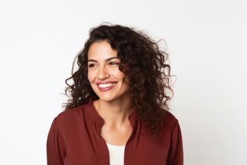 medium shot portrait of a happy Mexican woman in her 30s wearing a chic cardigan against a white background