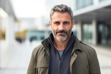 Naklejka premium medium shot portrait of a Israeli man in his 40s wearing a chic cardigan against a modern architectural background