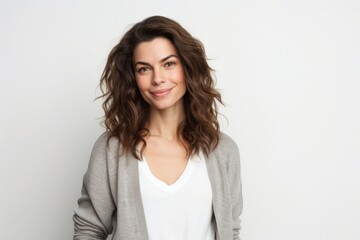 Obraz premium medium shot portrait of a Israeli woman in her 30s wearing a chic cardigan against a white background