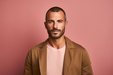 Fototapeta premium portrait of a Israeli man in his 30s wearing a chic cardigan against a pastel or soft colors background
