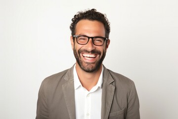 portrait of a Israeli man in his 30s wearing a chic cardigan against a white background