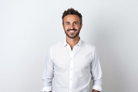 portrait of a Israeli man in his 30s wearing a chic cardigan against a white background