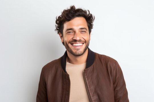 portrait of a Israeli man in his 30s wearing a chic cardigan against a white background