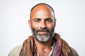 Fototapeta premium portrait of a Israeli man in his 40s wearing a foulard against a white background