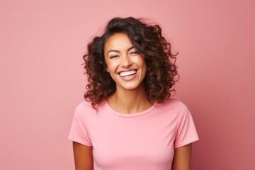 Obraz premium medium shot portrait of a Mexican woman in her 30s wearing a fun graphic tee against a pastel or soft colors background