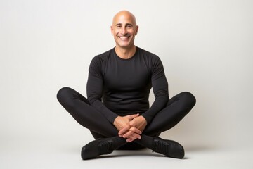 Fototapeta premium portrait of a Israeli man in his 40s wearing a pair of leggings or tights against a white background